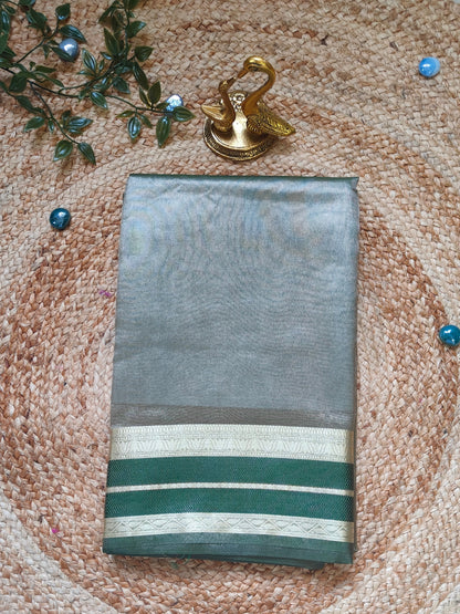 GREEN SEMI TISSUE SILK SAREE WITH GARHWAL  BORDER