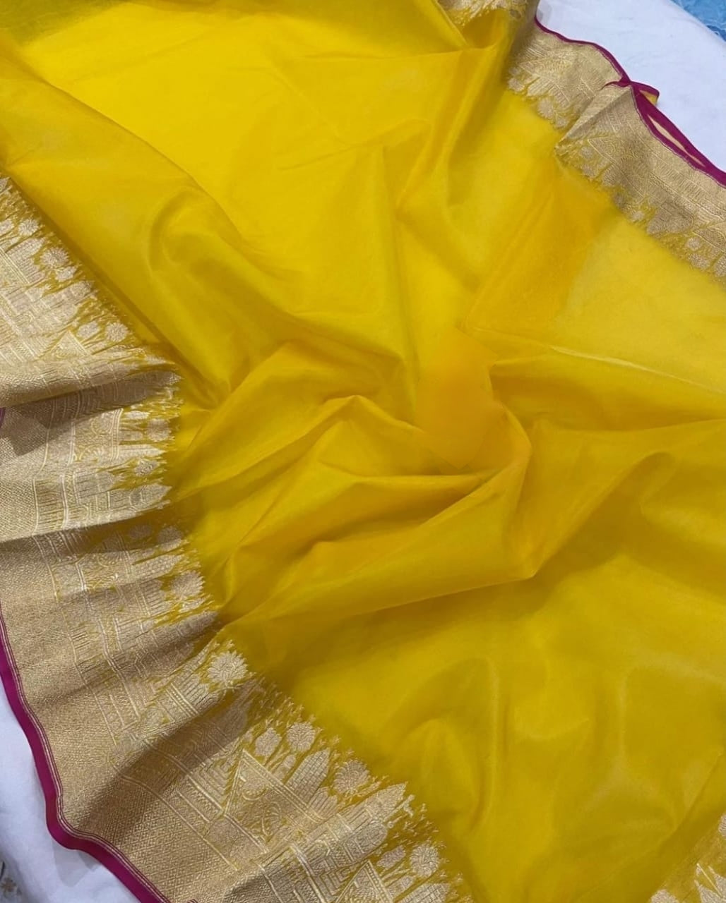 YELLOW ORGANZA SAREE WITH ZARI WEAVED TEMPLE BORDER
