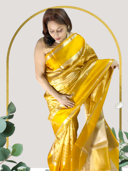 YELLOW SEMI TISSUE SILK WITH ZARI STRIP  GARHWAL BORDER
